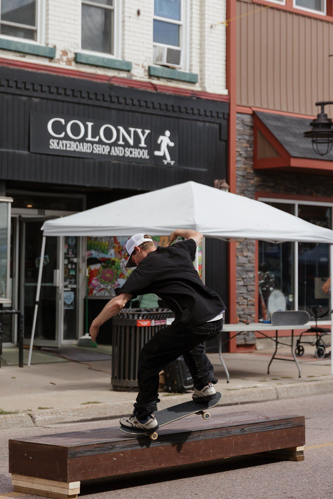 A skateboarder grinding a ledge during the skateboard demo.